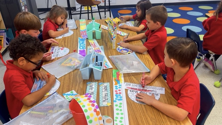 kindergartners creating dot hats
