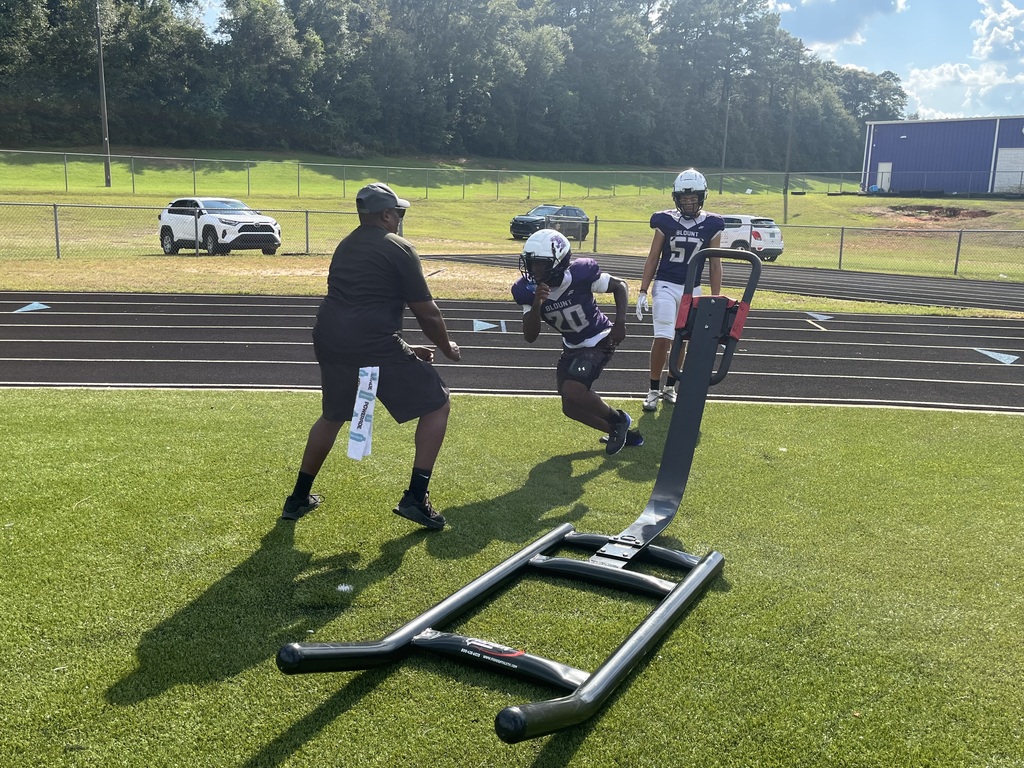 Blount football players practicing with their new football equipment.