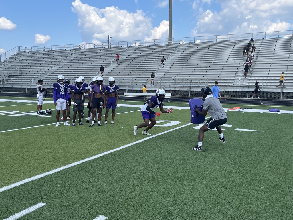 Blount football players practicing with their new tackle equipment. 