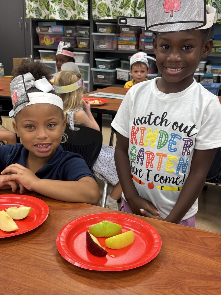 Two kids, one with an apple plate, wear paper chef hats. One says "Watch out, kindergarten is coming."
