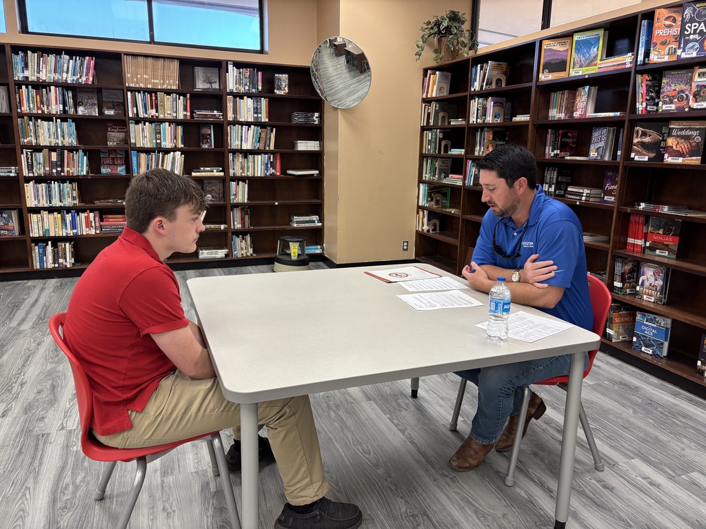 Student and interviewer at Theodore