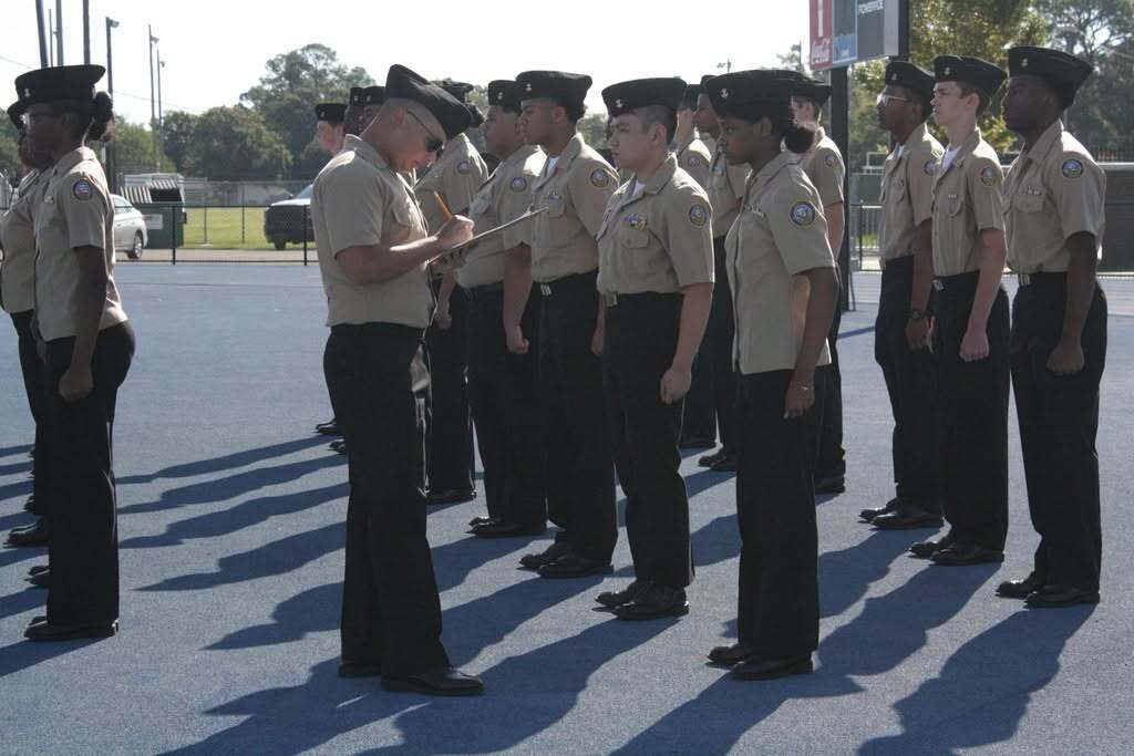 A JROTC instructor inspecting a formation of cadets