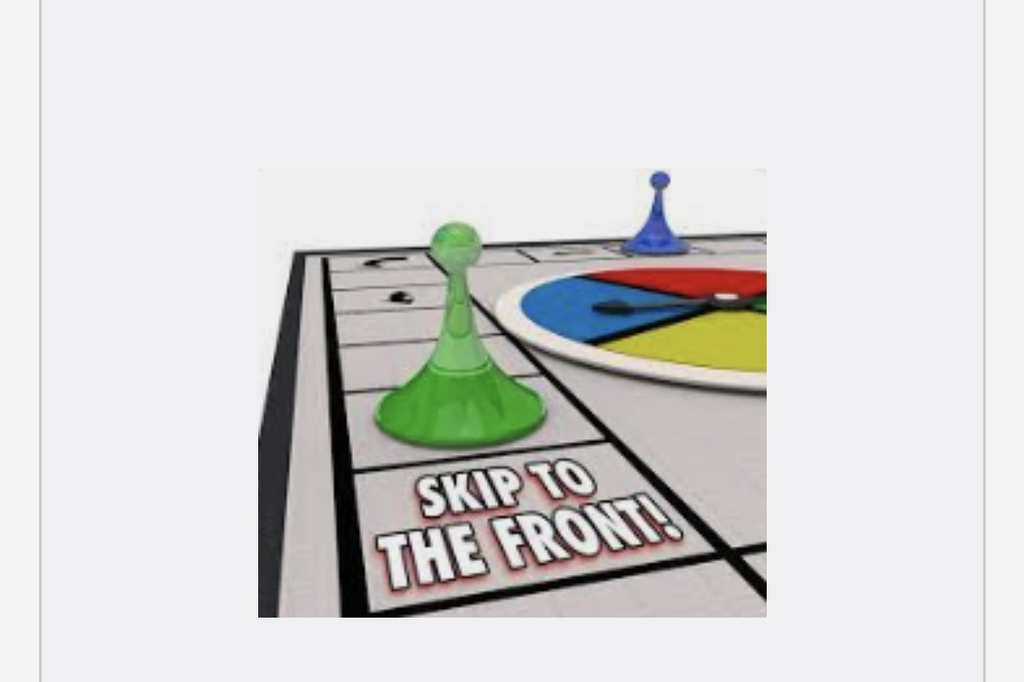 A game board with the words "Skip to the front!" and a spinner. Two game pieces are on the board.