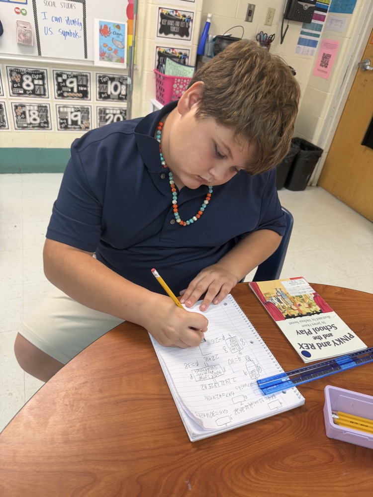 student measuring library book