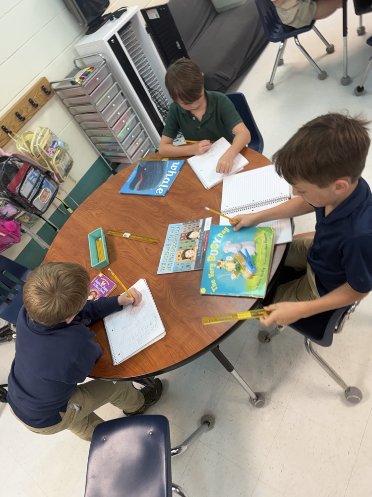 student measuring library book