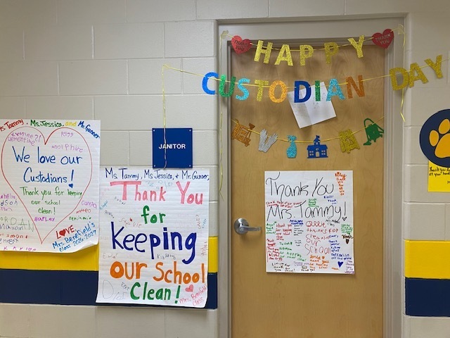 Three posters, one saying "Thank You for Keeping Our School Clean", and a door with "Happy Custodian Day" on it.