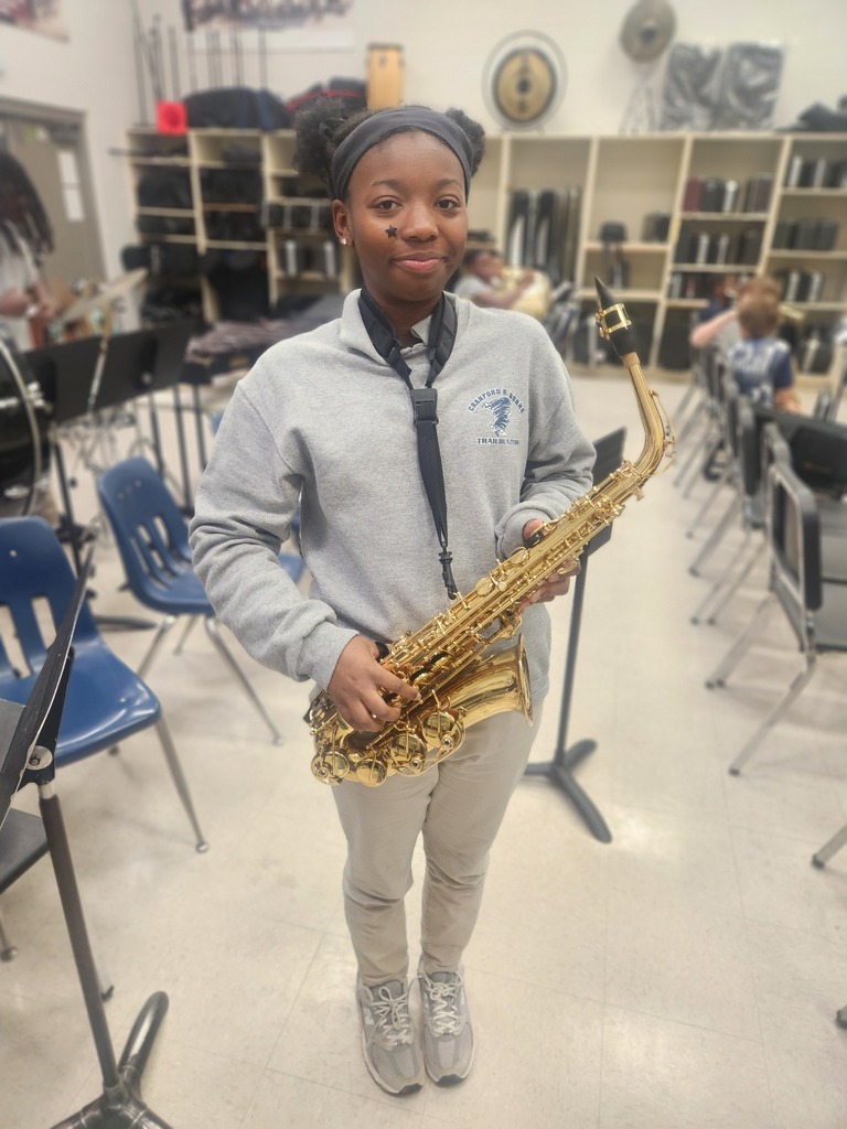Student with a saxophone.