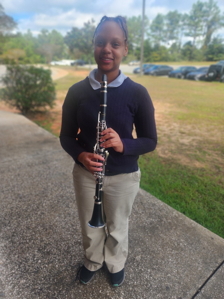 Band student with clarinet.