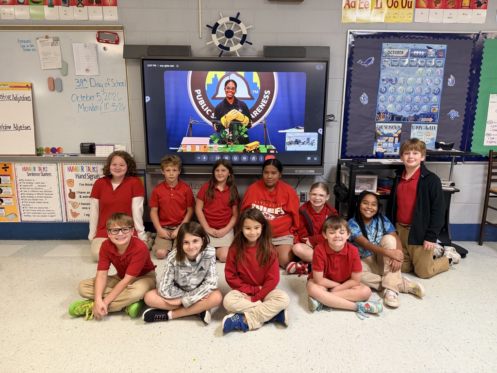 Fourth grade students in Mrs. Allen's 4th grade class met with a team member at Alabama Power to review safety lessons with Safe-T-Opolis. Students are sitting in front of the view sonic board.
