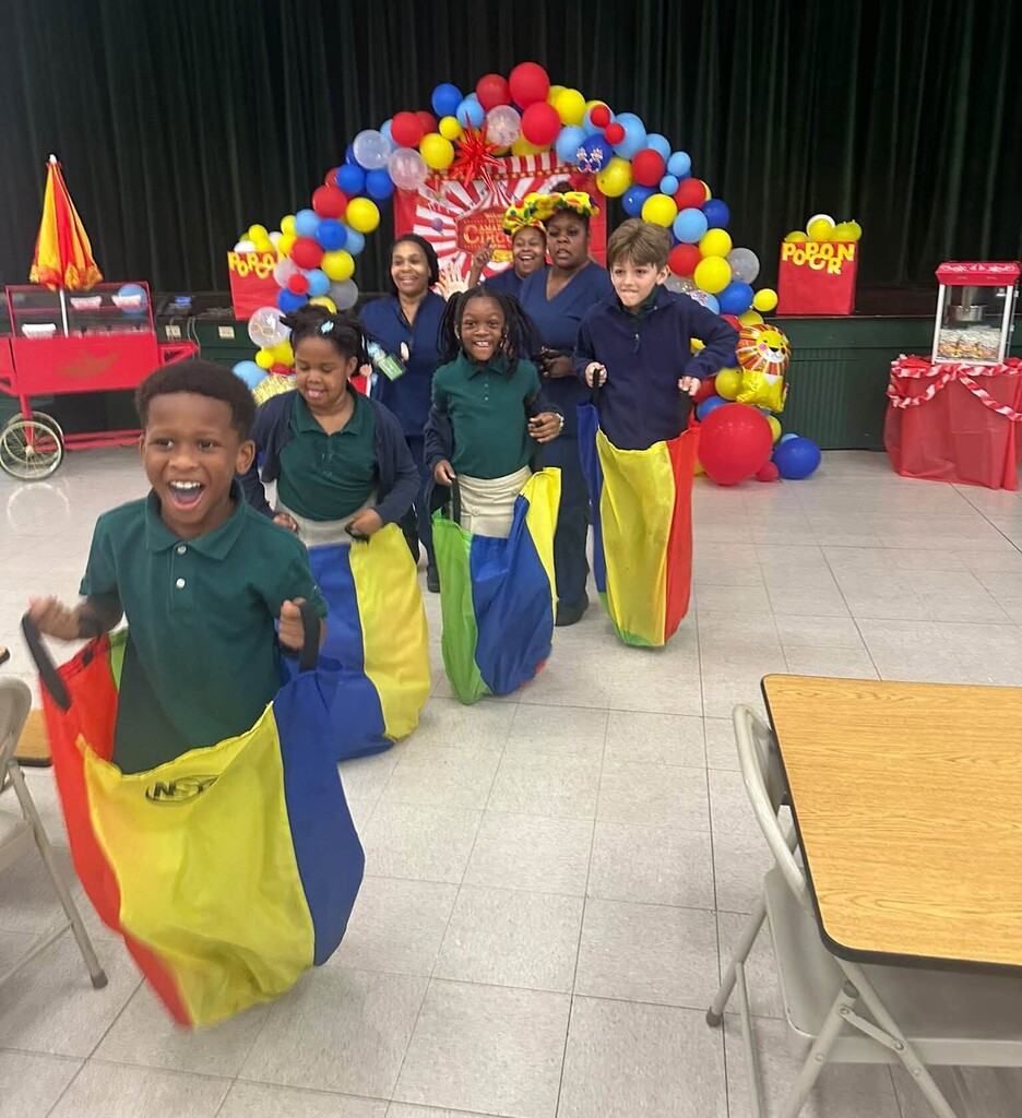 Students in a bag race in a cafeteria