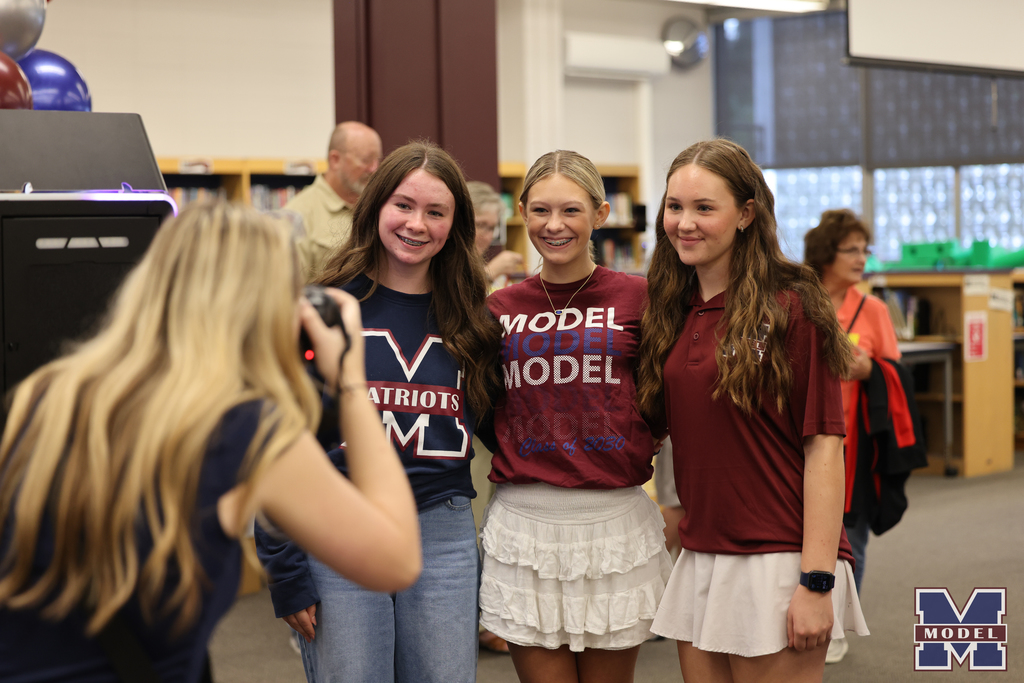 three girls smiling for a photo