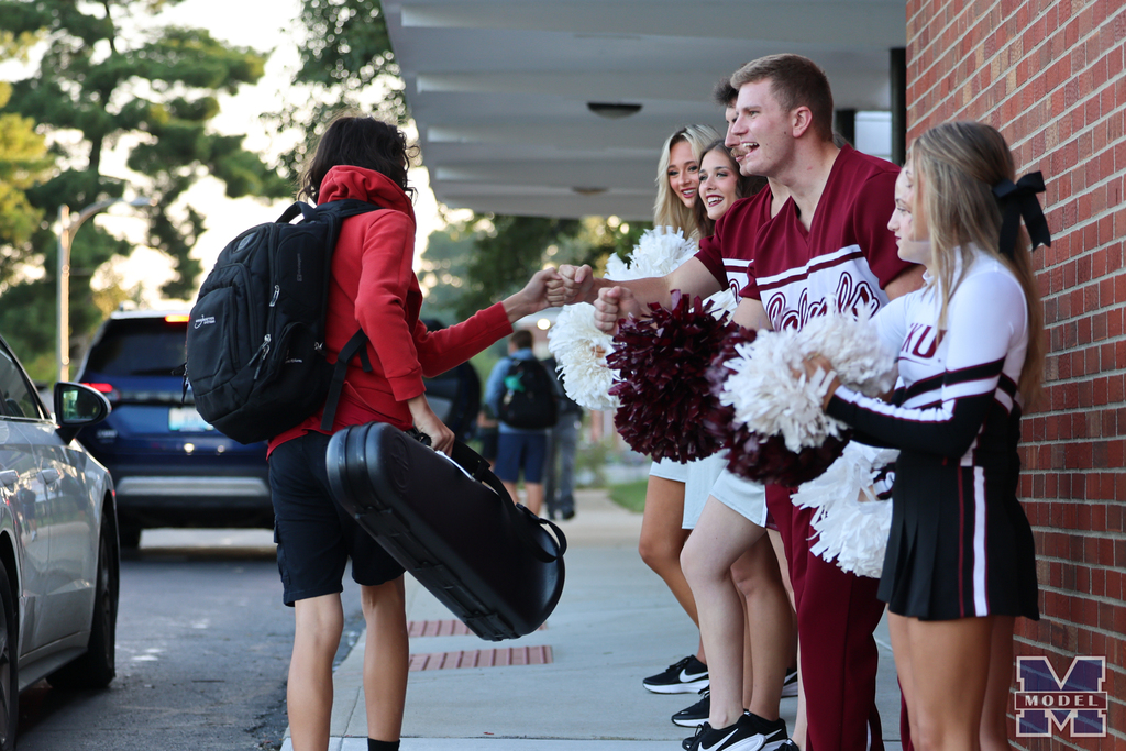 eku cheer fist bump