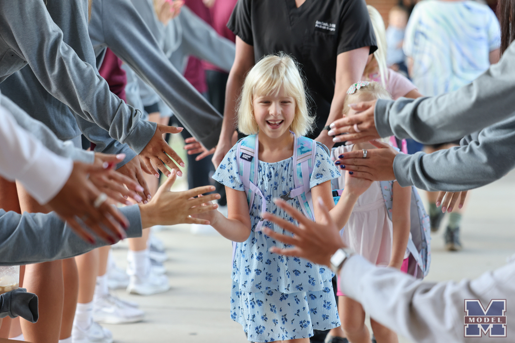 girl getting high-fives