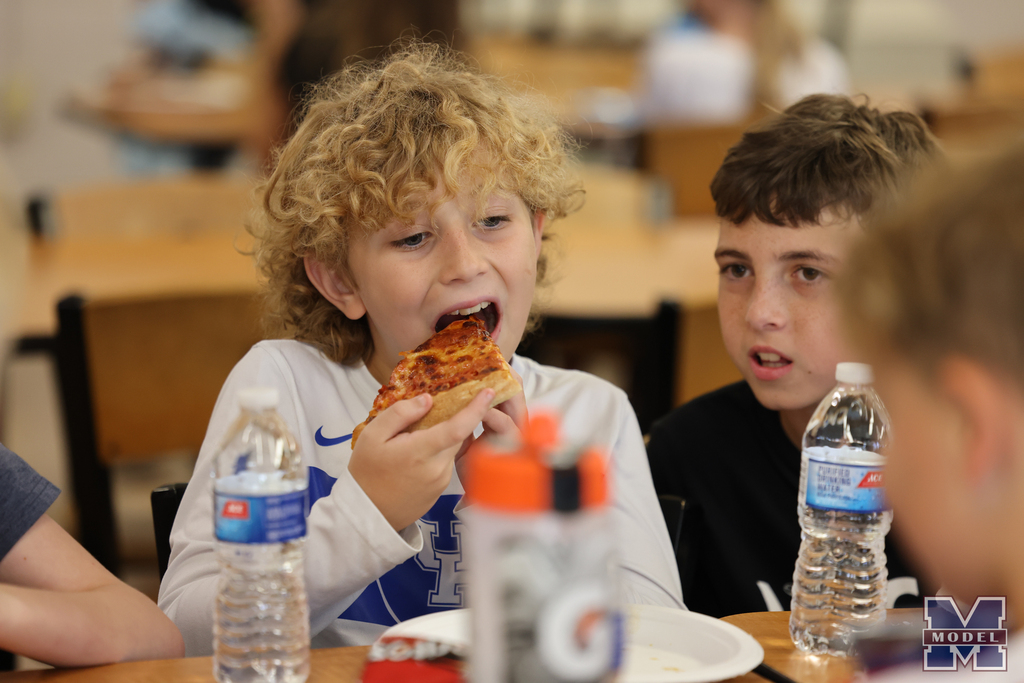 boy eating pizza
