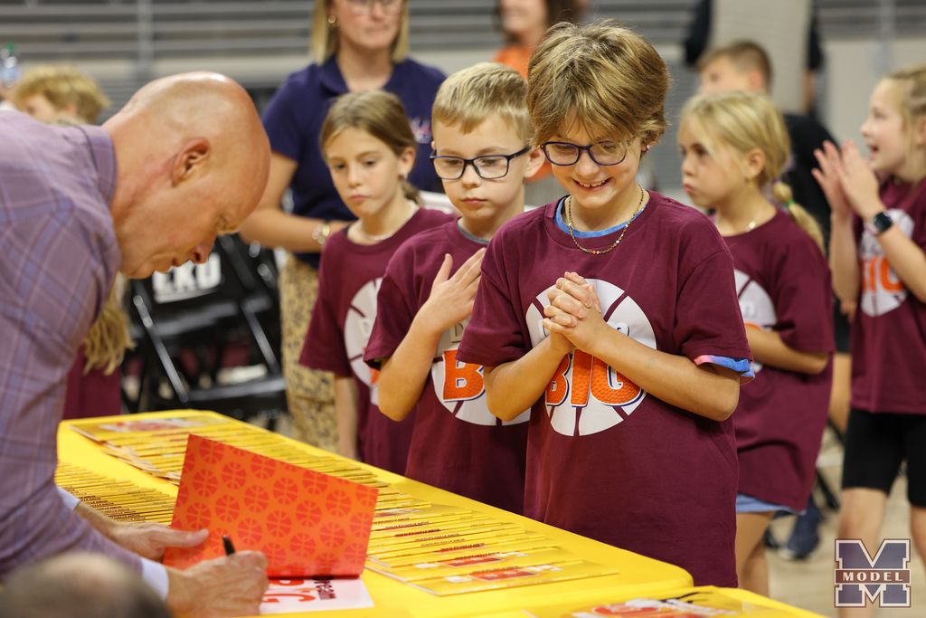 excited student waiting for signed book