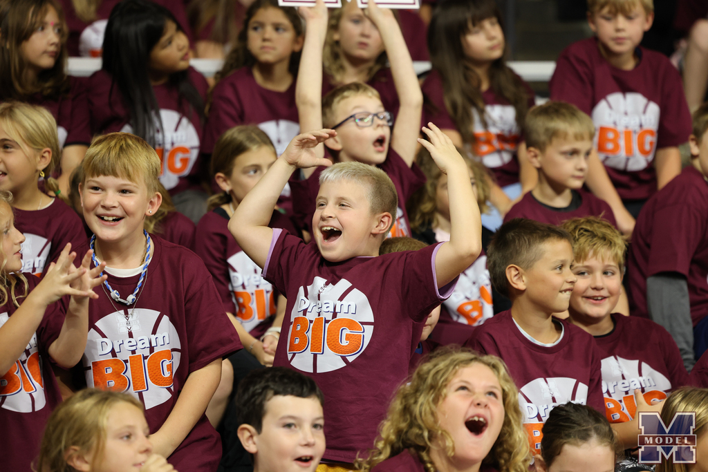 students cheering in crowd