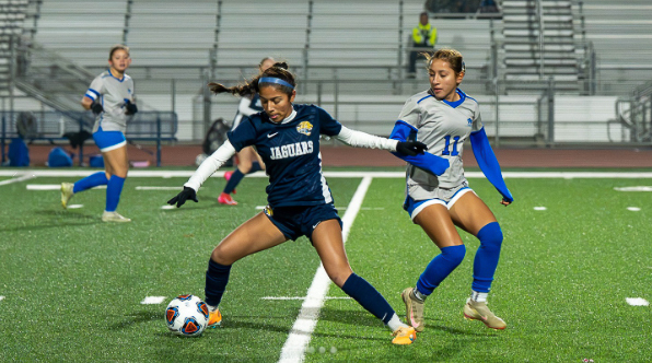Gregori Girls soccer player protects ball from Sierra High opponent