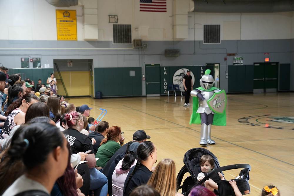La Loma Lancer mascat standing in the middle of the gym