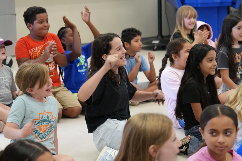 Group of happy students at school presentation