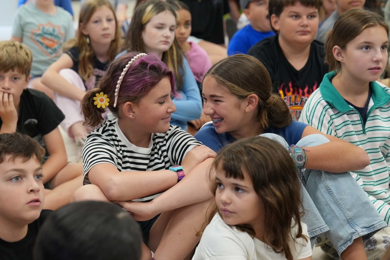 Group of happy students at school presentation