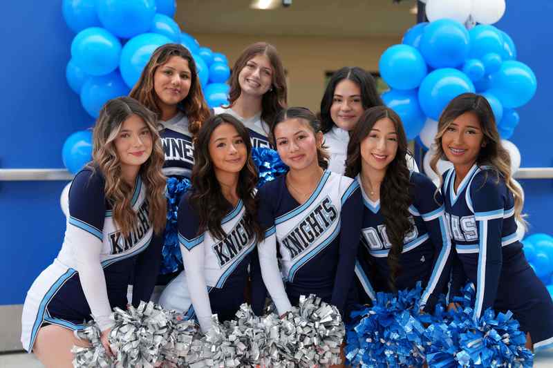 Downey High Cheerleaders welcome families to John Muir Elementary School