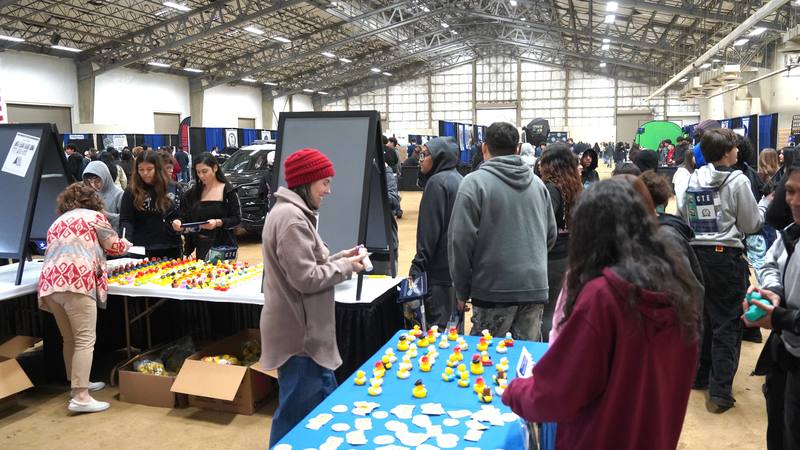 Eighth grade students visiting the Map Your Mission College and Career Readiness booth at Inspire Youth, Inspire Dreams Expo.