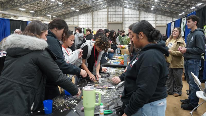 Ag Science students lead eighth graders in a floral design activity.