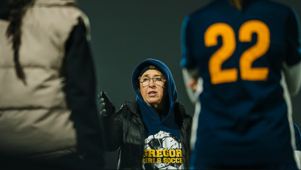 Photo by Jaguar News Network students of Gregori Girls Soccer Coach Tracy Moore talks with team during preseason game.