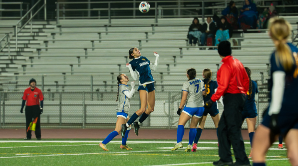 JNN Photo of Gregori player jumping up in the air to head a soccer ball during the team's game against Sierra High School.