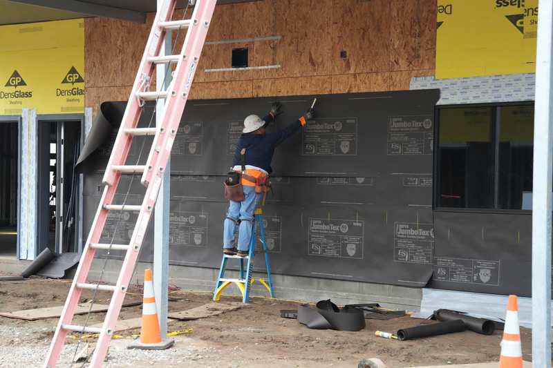 Construction worker on ladder at Franklin Elementary School