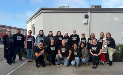 MCS staff members wear Be The Change t-shirts