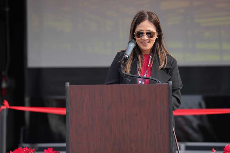Modesto High Principal Phuc Pham-Goulart at podium