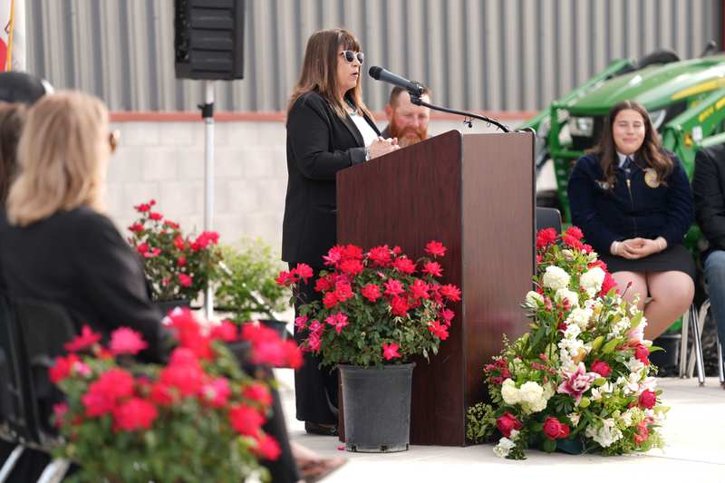 Teacher Tammy Burris at podium