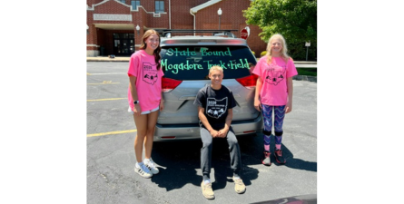 Photo of students before heading to state track and field championships.