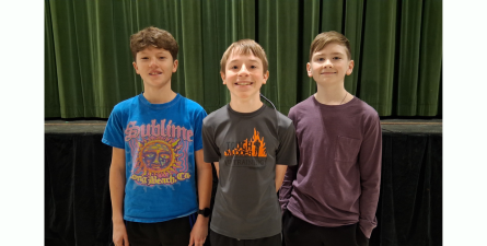 Three male students who won the spelling bee.