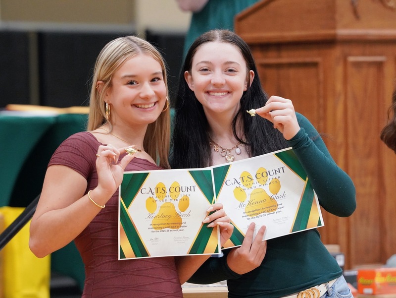 Photos of students holding their awards