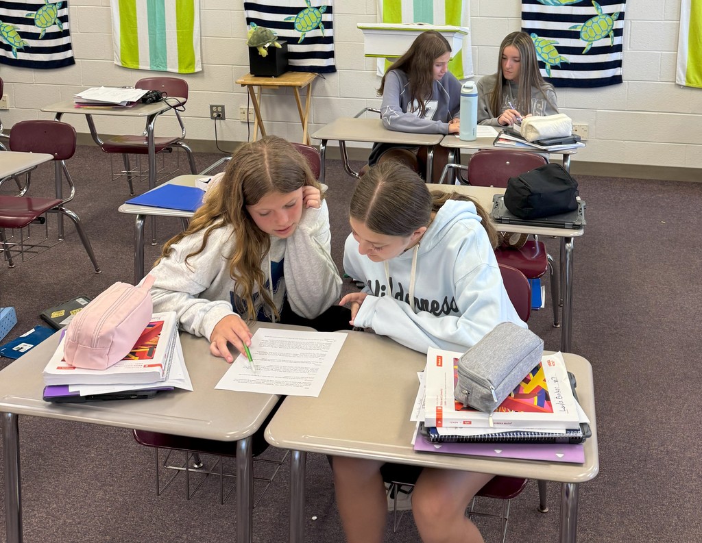 students look at writing
