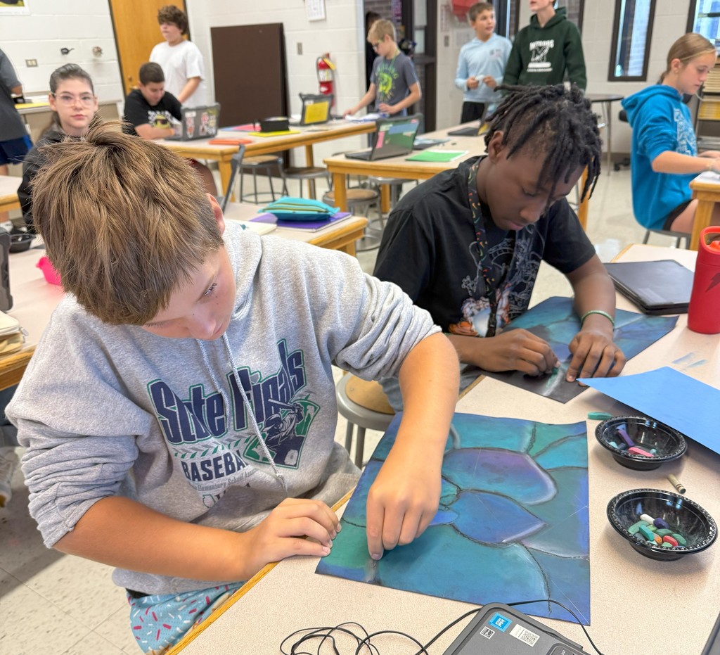 students drawing with chalk