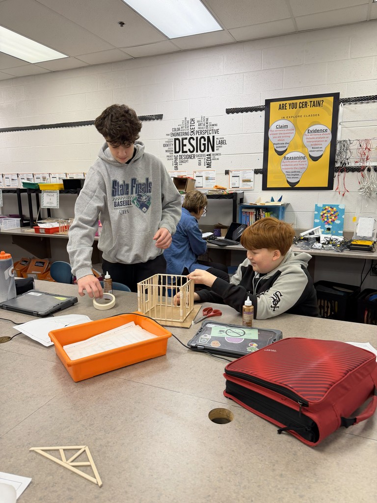 students building models with wood and glue