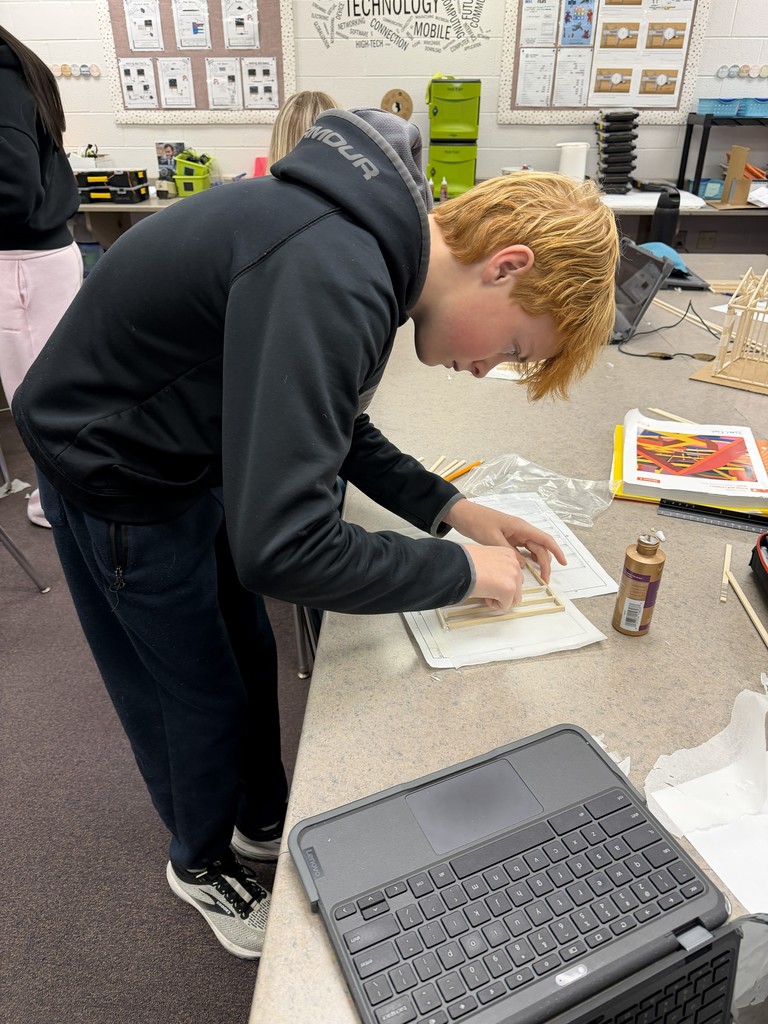 students building models with wood and glue