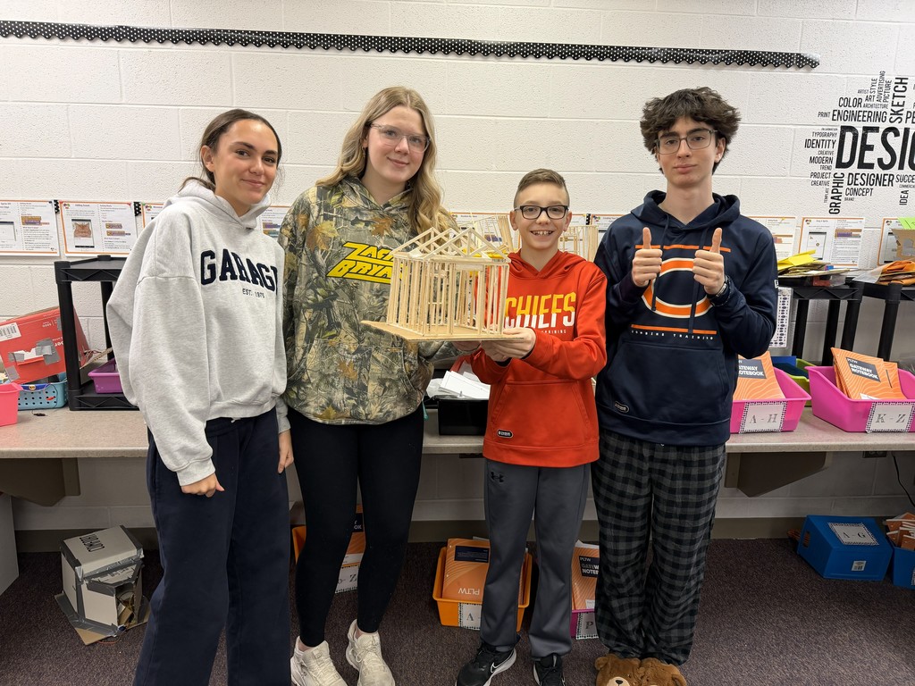 students building models with wood and glue