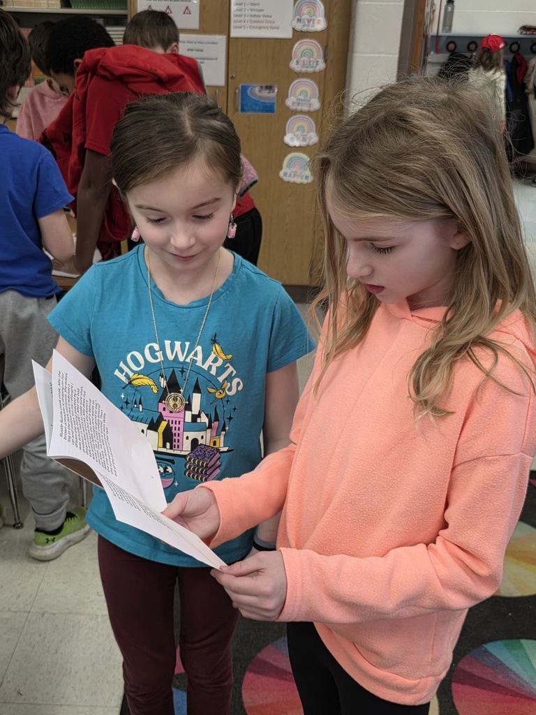 4th graders reading to 3rd graders