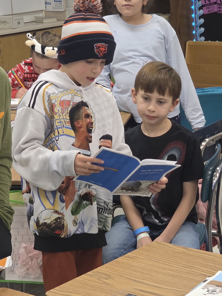 4th graders reading to 3rd graders