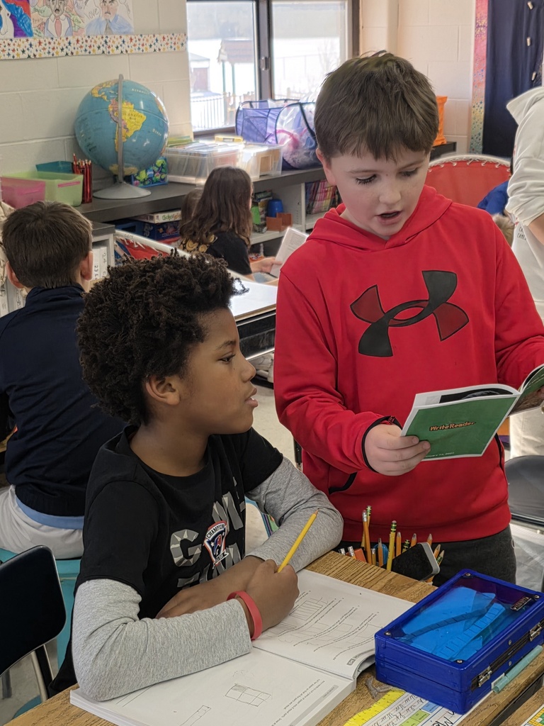 4th graders reading to 3rd graders