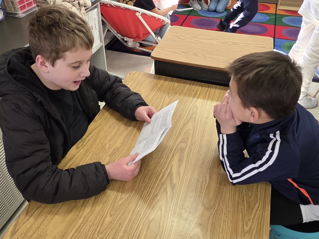 4th graders reading to 3rd graders