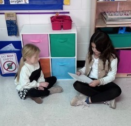 students reading to each other