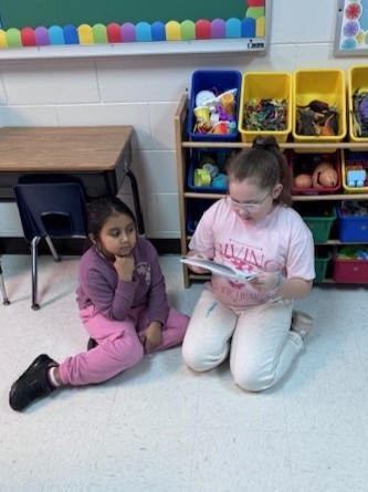 students reading to each other