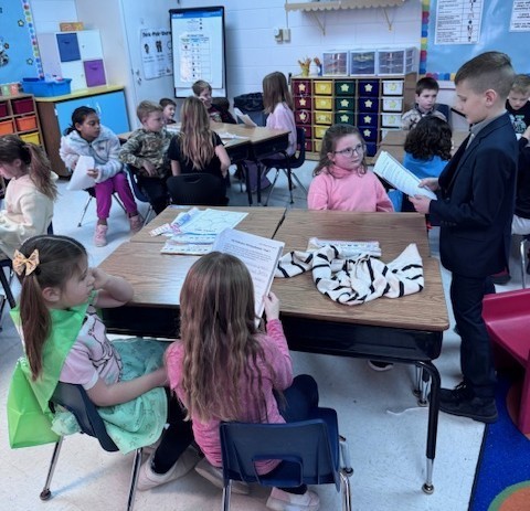 students reading to each other