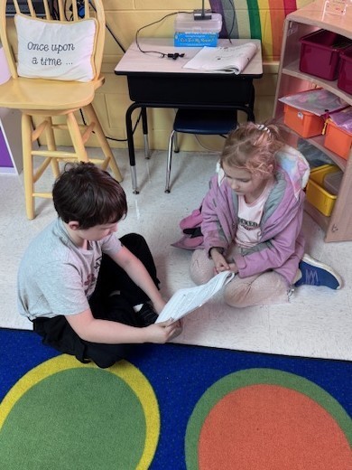 students reading to each other