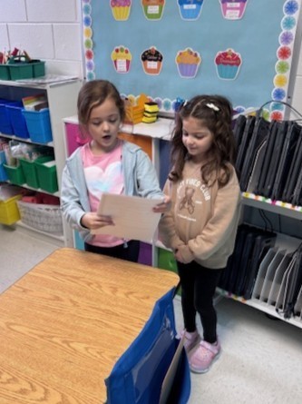 students reading to each other